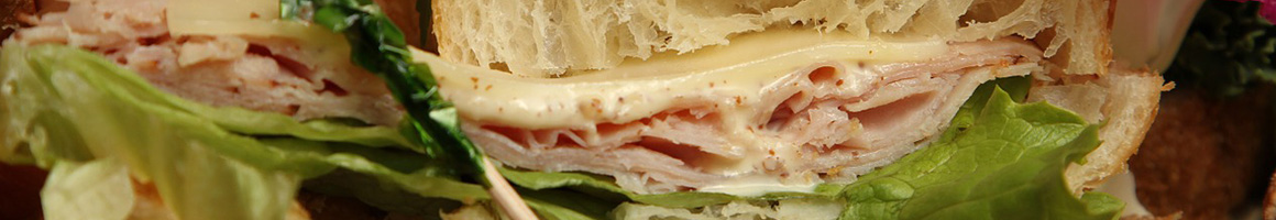 Eating Sandwich at Blue Ox Sandwich Factory restaurant in Burnsville, MN.